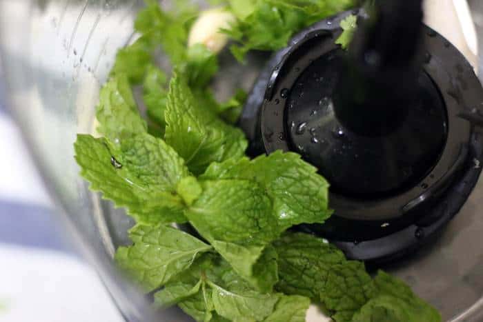 mincing mint leaves and garlic cloves