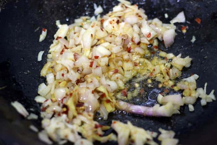 sauteing chopped onions in sesame oil