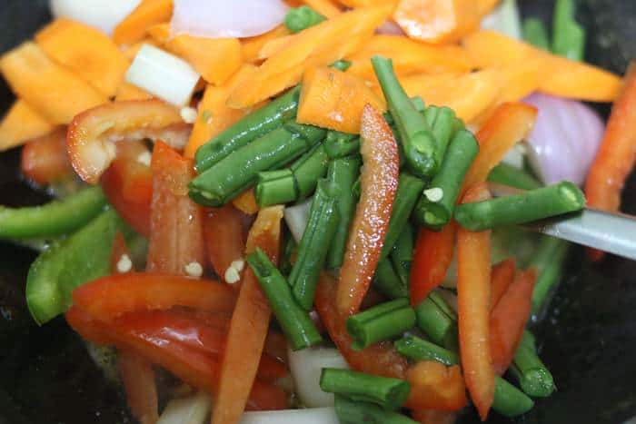 sauteing vegetables in wok