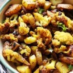 Punjabi aloo gobi sabzi dry served in a enamel bowl