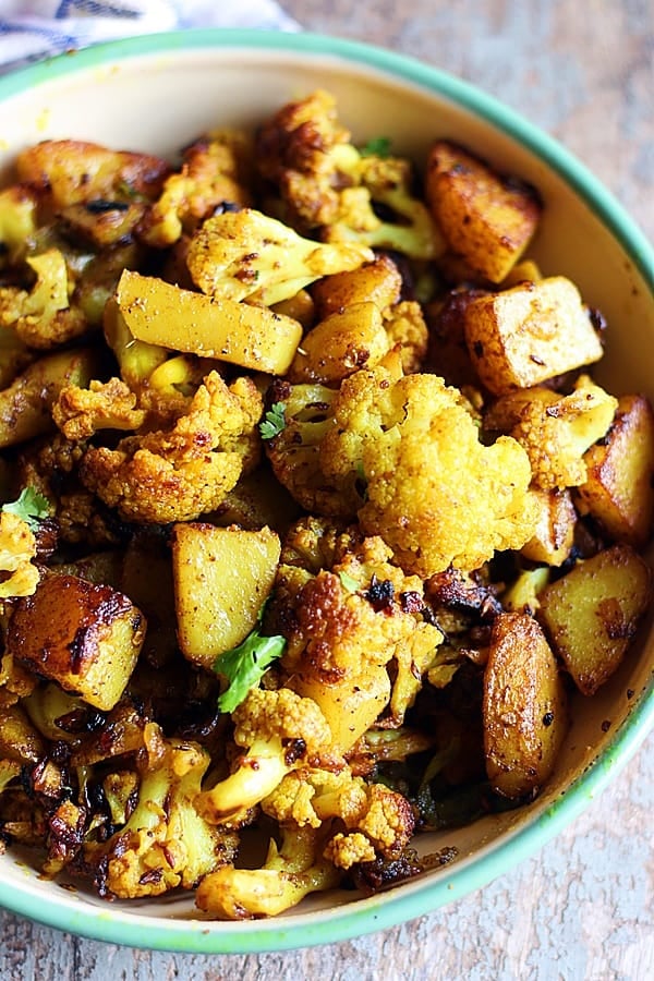 easy and best aloo gobi served in a green pan