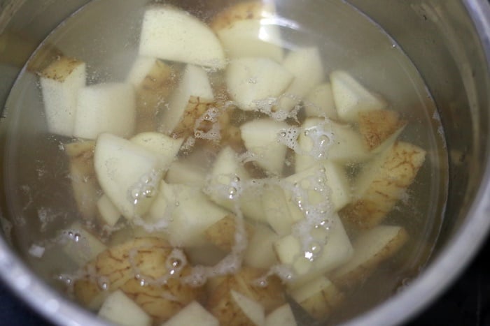 cubed potatoes soaked in water