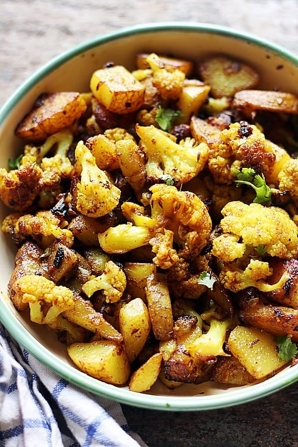 Punjabi aloo gobi sabzi dry served in a enamel bowl