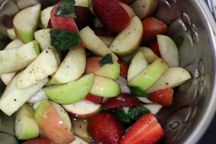 making salad with apple and walnuts