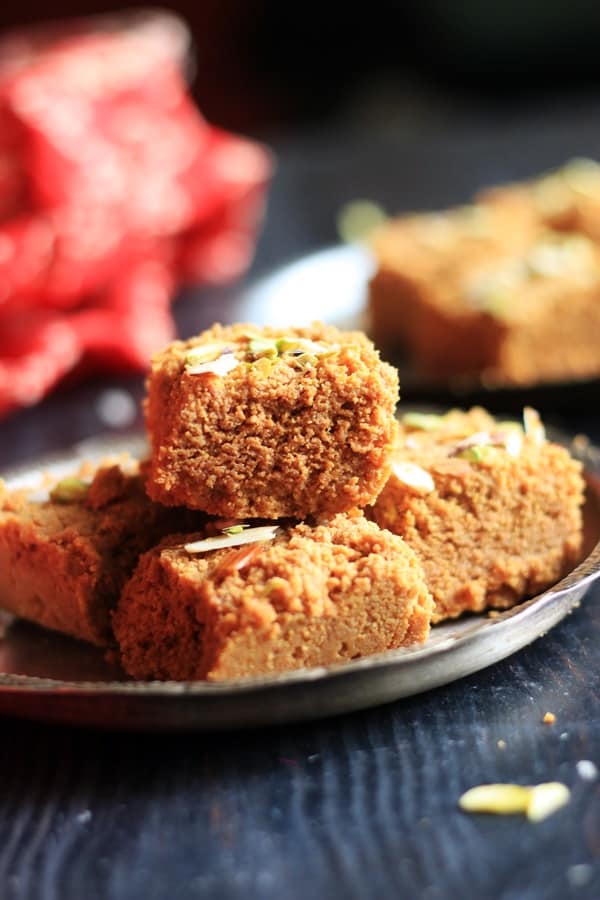 stack of delicious mohan thal- chickpea fudge in a silver plate