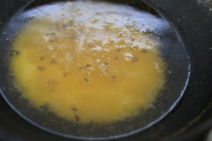 melting ghee in a pan