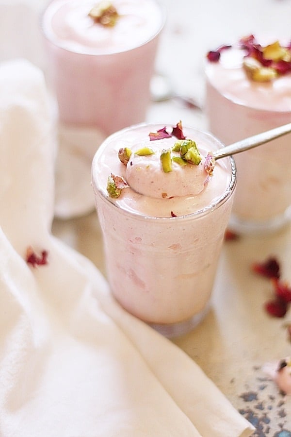 Rose milk mousse served in a small glass with spoon