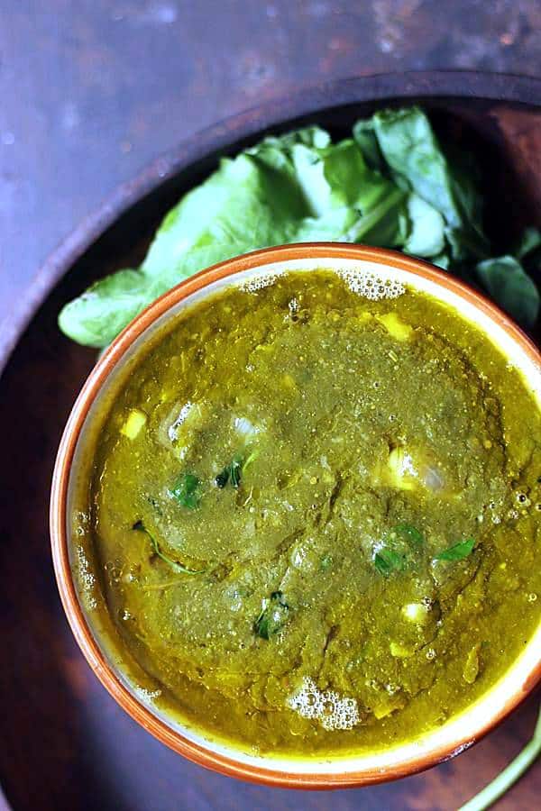 sarson ka saag in a ceramic bowl