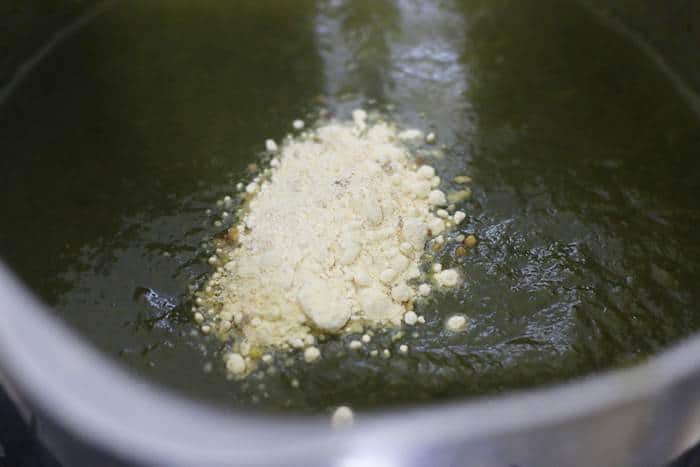 maize flour added to simmring saag