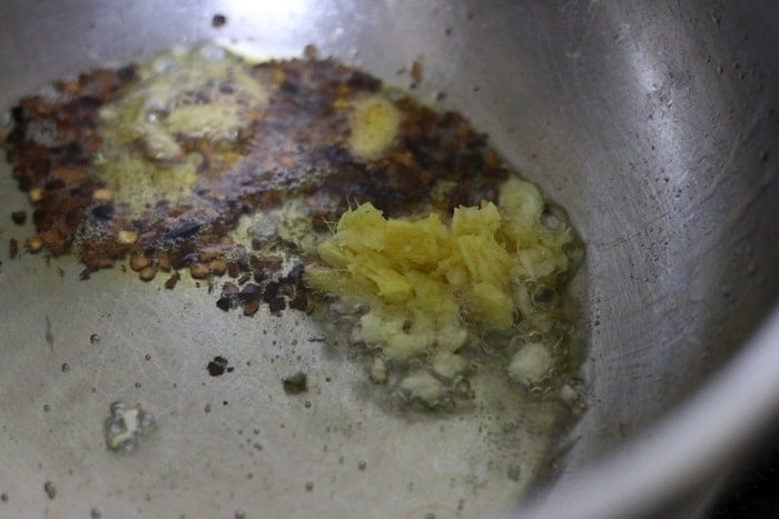 sauteing ginger garlic and chili flakes in hot oil