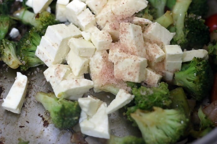 cubed tofu added to stir fried vegetables