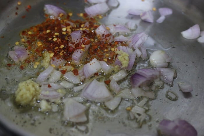 sauteing chili flakes, onion and garlic in sesame oil