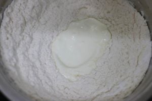 curd or yogurt added to flour mixture