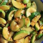 Smashed cucumber salad served in an enamel bowl