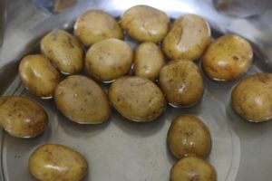 cleaning tiny potatoes to make smashed potatoes