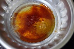 oil, chili powder and salt mixed in a bowl