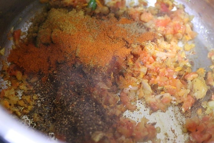 spice powders added to onion tomato for making recipe amritsari chole-punjabi chole