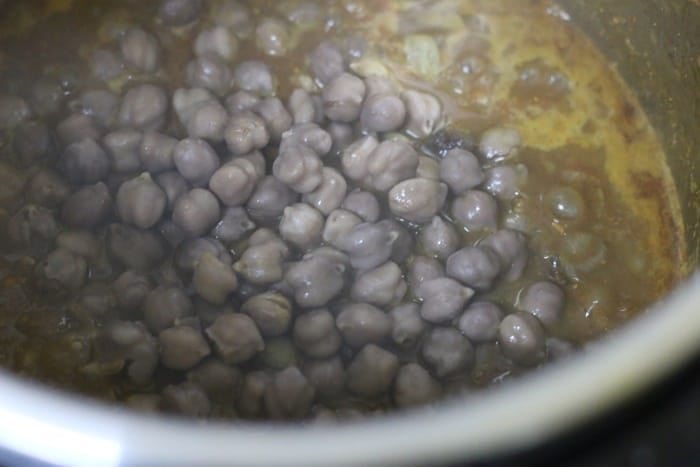 cooked chickpeas added to chole masala base