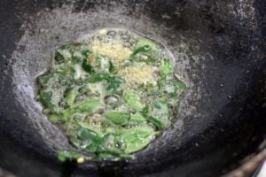 tempering mustard seeds, urad dal, curry leaves in oil