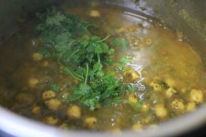 finely chopped coriander leaves or cilantro leaves added to chana saag