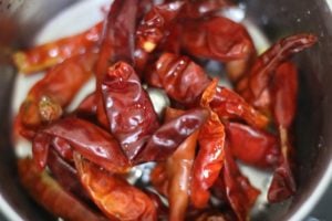 soaked and drained red chilies in a food processor jar for making harissa sauce recipe