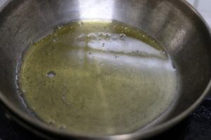 heating olive oil in a pan