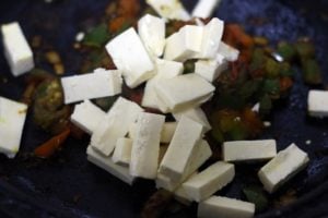 paneer strips added to masala base of paneer khurchan