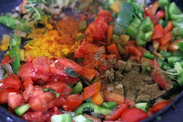 spice powders added to sautéed vegetables