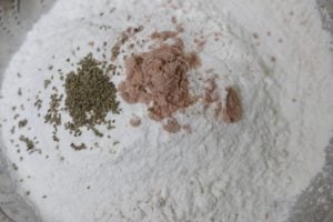 All purpose flour or maida, ajwain and salt in a mixing bowl