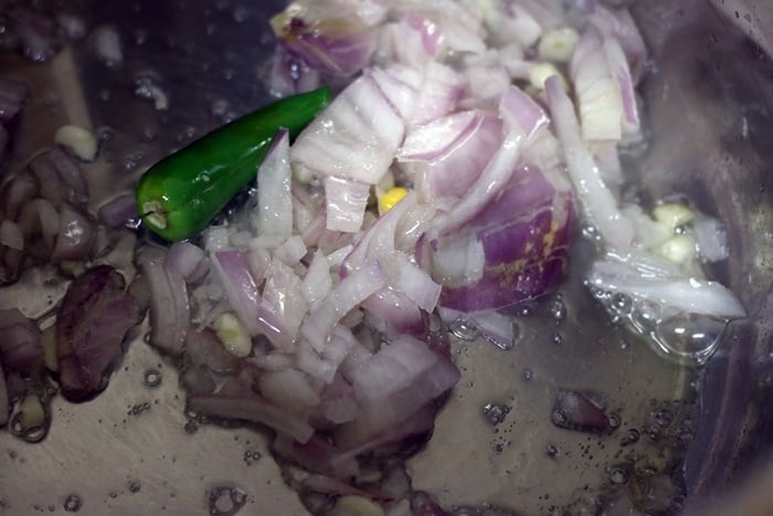 sautéing onions and corn in olive oil