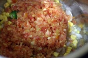 minced tomatoes added to sauteed onions