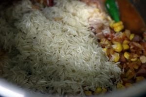 drained rice added to vegetables