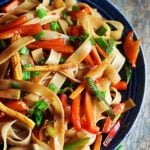 easy thai drunken noodles with vegetables in a ceramic plate