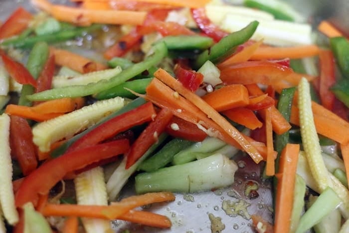 chopped vegetables added to sautéed ginger garlic