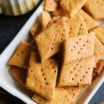 besan papdi- gluten free crispy chickpea crackers in a ceramic with tea in background