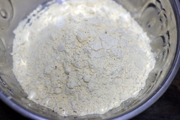 chickpea flour or besan in a mixing bowl