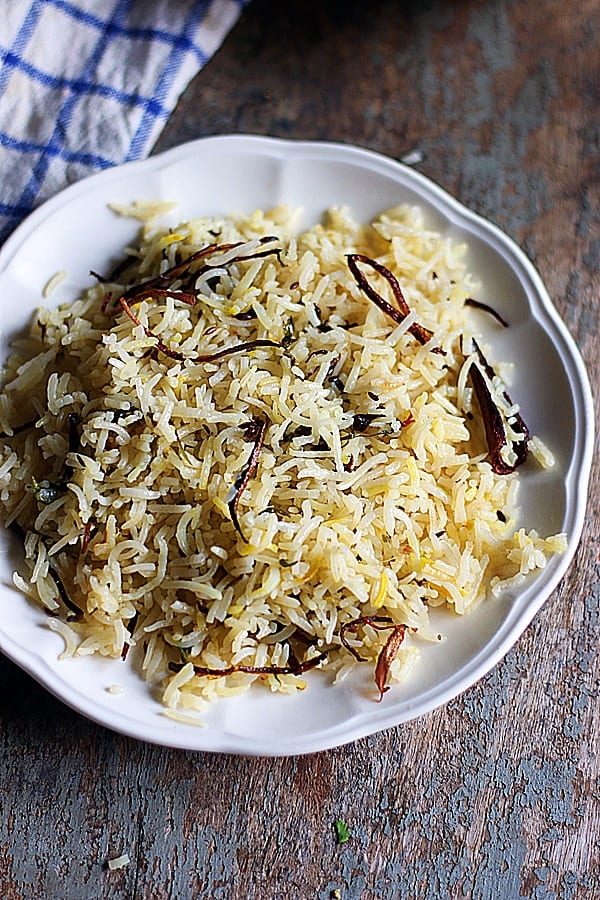 biryani rice topped with fried onions ready to serve