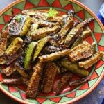 crispy dondakaya fry in a red ceramic plate