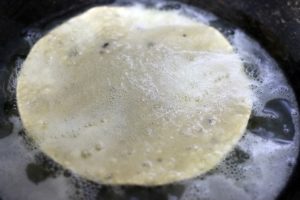 frying papad in oil