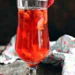 warm strawberry tea served in a tall glass