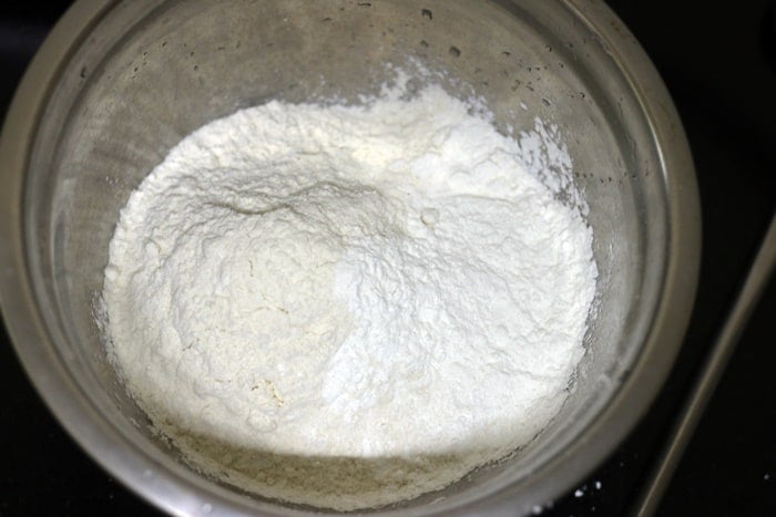 plain flour, corn starch and a pinch of salt in a mixing bowl.
