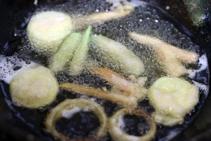 deep frying tempura vegetables in hot oil