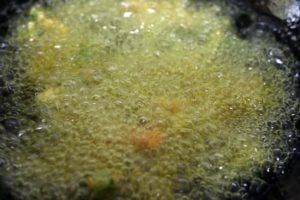 frying pakora in hot oil