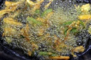 crispy golden brown pakora getting fried