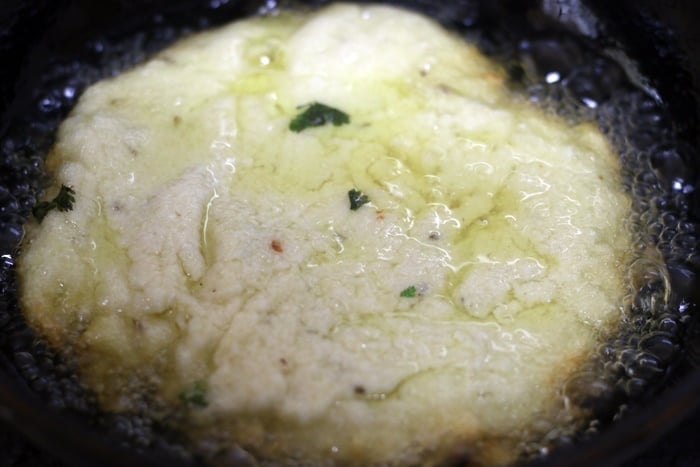 cooking minapa roti in a pan