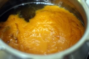mixing mango pulp with sugar syrup