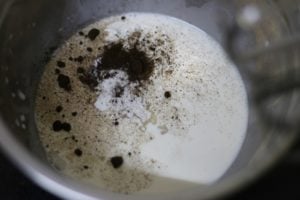 heaby cream, vanilla and icing sugar in a mixing bowl.