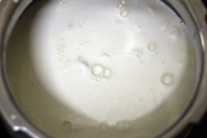 simmering milk in a saucepan