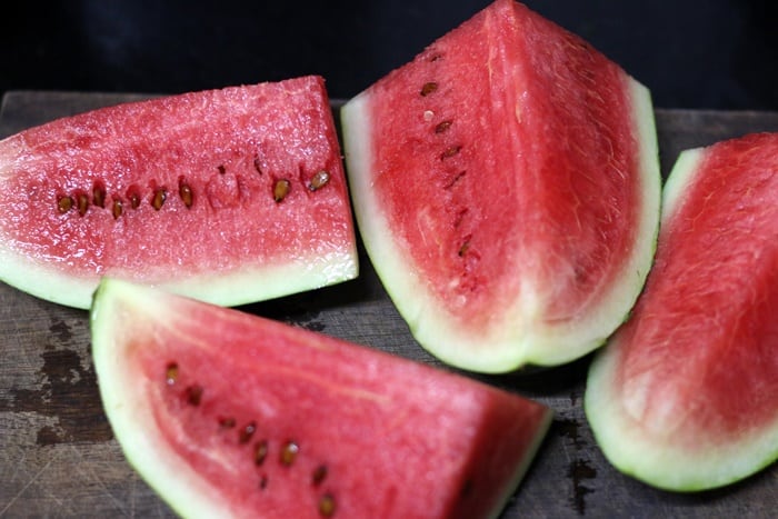 steps showing how to cut a watermelon