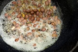 tempering mustard seeds, urad dal and chana dal for vermicelli upma